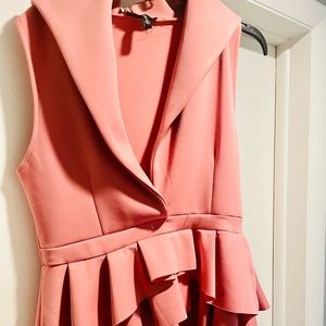 Fun top with peplum. Dress up or down!